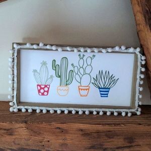 Wood framed cactus wall hanging
